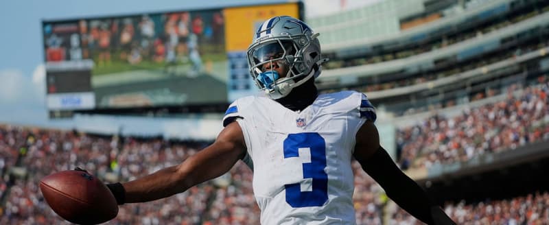 Footballer George Pickens angrily tosses helmet following costly missed catch and interception.